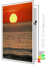 Serene orange sun setting on calm ocean horizon with gentle waves and reflection